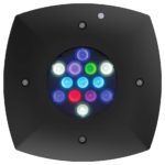 close up product shot of the aquaillumination Prime 16 light. It's a small square black case with a cluster of 16 led lights in the center. The led lights are different colors including white, purple, red, green, uv, and blue, and meant for saltwater aquarium coral